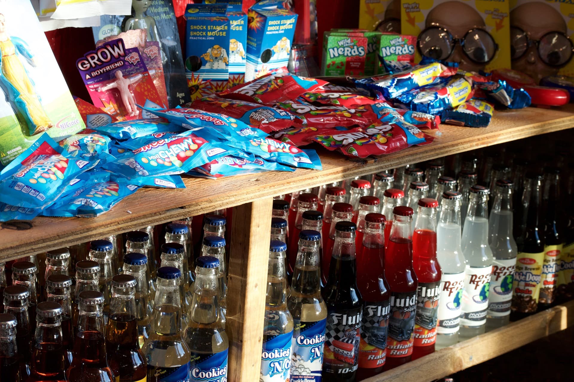 The candy and glass-bottle soda shelf at Scoops Venice Ice Cream
